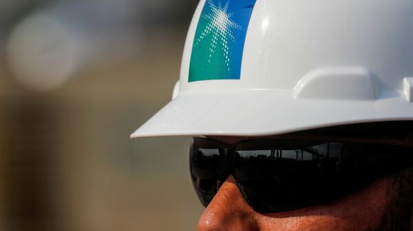 An employee in a branded helmet is pictured at Saudi Aramco oil facility in Abqaiq, Saudi Arabia October 12, 2019 - Sputnik International