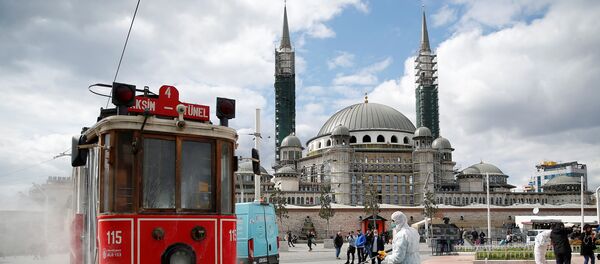 A municipality worker sprays disinfectant over a tram to prevent the spread of coronavirus disease (COVID-19) in central Istanbul, Turkey, March 18, 2020 - Sputnik International