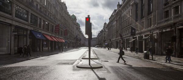 A man crosses a deserted Regent Street - usually one of London's busiest thoroughfares A man crosses a deserted Regent Street - usually one of London's busiest thoroughfares - Sputnik International