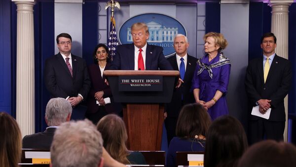 U.S. President Donald Trump attends the daily coronavirus response briefing as members of the administration's coronavirus task force standby at the White House in Washington, U.S., March 18, 2020. - Sputnik International