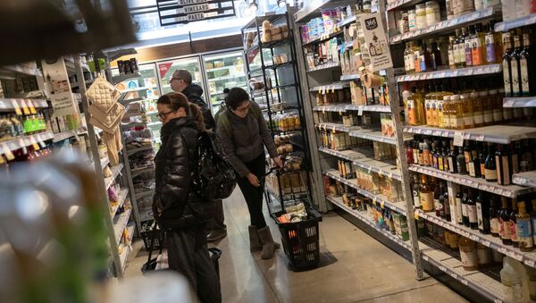 Customers shop in a store following the outbreak of coronavirus disease (COVID-19), in New York City, U.S., March 16, 2020.  - Sputnik International