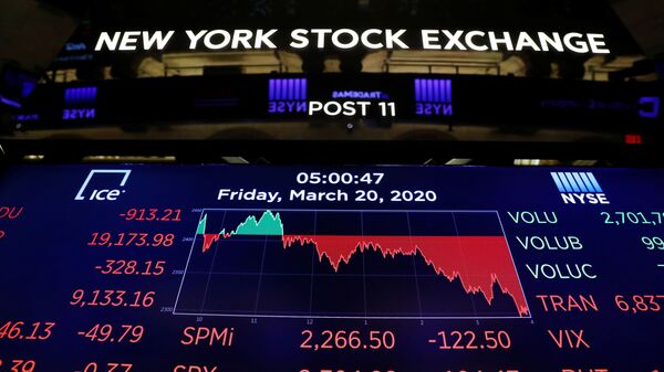 The final numbers of the day are displayed above the floor of the New York Stock Exchange (NYSE) stands empty as the building prepares to close indefinitely due to the coronavirus disease (COVID-19) outbreak in New York, U.S., March 20, 2020 - Sputnik International