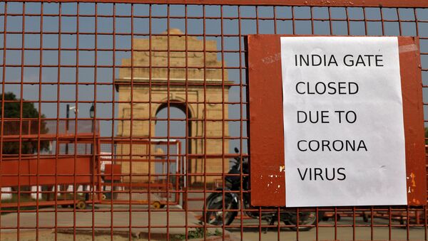 A sign pasted on a security barricade is seen after the India Gate war memorial was closed for visitors amid measures for coronavirus prevention in New Delhi, India, March 19, 2020.  - Sputnik International