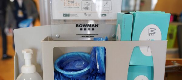 Masks and sanitizing items are on hand in a patient check-in desk for coronavirus testing in the emergency room at Fort Belvoir Community Hospital in Fort Belvoir, Virginia, U.S., March 18, 2020 - Sputnik International