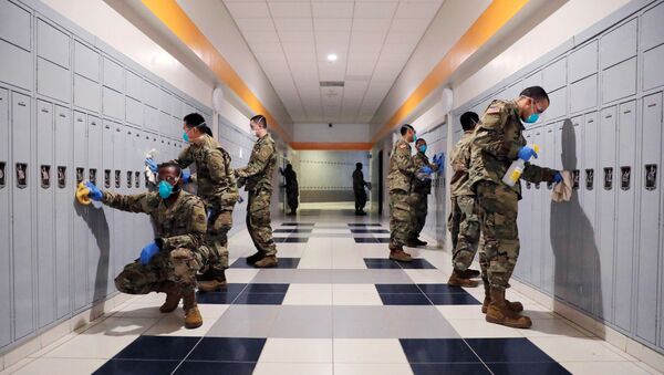 Soldiers From New York Army and Air National Guard work to sanitize the New Rochelle High School  - Sputnik International