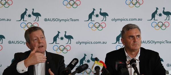 Australian Olympic Committee Chief Executive Matt Carroll (L) and Australian Team Chef de Mission for Tokyo 2020 Ian Chesterman address the media during a press conference regarding the coronavirus disease (COVID-19) in Sydney, Australia, March 19, 2020. Picture taken March 19, 2020 - Sputnik International