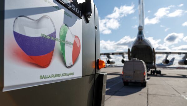 Russian servicemen load medical equipment and special disinfection vehicles into cargo planes while sending the supply to Italy, hit by the outbreak of coronavirus disease (COVID-19), at a military airdrome in Moscow region, Russia March 22, 2020 - Sputnik International
