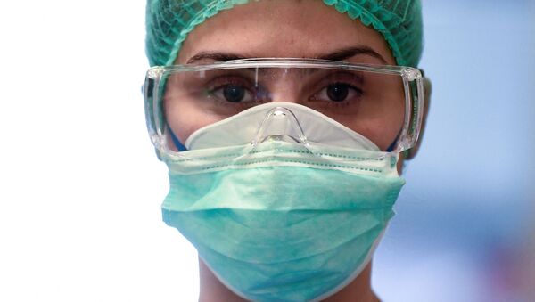 Medical worker in mask - Sputnik International