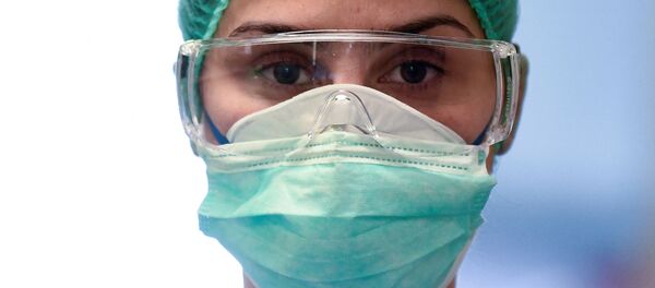 Medical worker in mask - Sputnik International