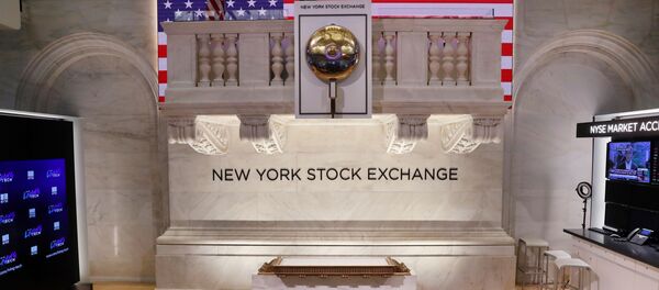 The bell used to open and close the markets hangs in front of an empty podium above the floor of the New York Stock Exchange (NYSE) as it prepares to close due to the coronavirus disease (COVID-19) outbreak in New York, U.S., 20 March, 2020 - Sputnik International