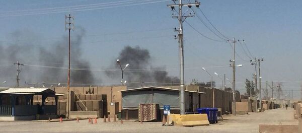 The US Army soldier that provided the photo to Fox News says that the pits are about 400 yards from their barracks and that the smoke often hangs over their section of the base. Camp Taji, Iraq, July 11, 2018. - Sputnik International