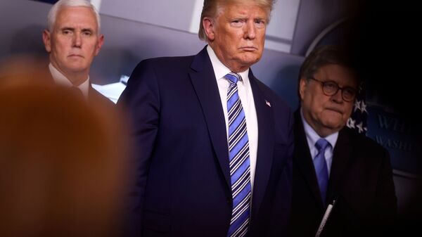 U.S. President Donald Trump looks at a reporter asking a question as he stands with Vice President Mike Pence and Attorney General William Barr during the coronavirus response daily briefing at the White House in Washington, U.S., March 23, 2020. - Sputnik International