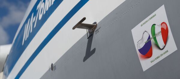 In this handout photo released by the Russian Defence Ministry, an Ilyushin Il-76 with medical equipment for transfer to Coronavirus-Hit Italy is pictured at the Chkalovsky Airport, Moscow region, Russia In this handout photo released by the Russian Defence Ministry, an Ilyushin Il-76 with medical equipment for transfer to Coronavirus-Hit Italy is pictured at the Chkalovsky Airport, Moscow region, Russia - Sputnik International