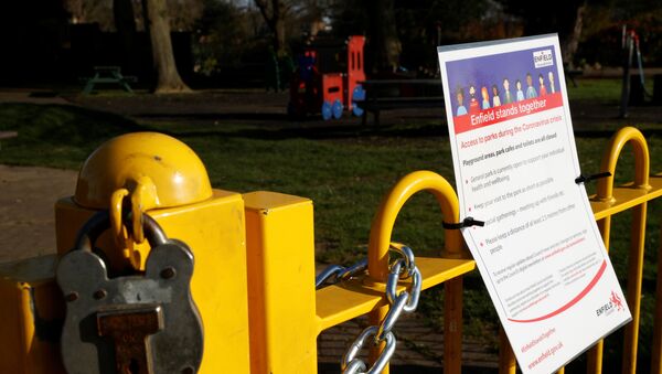 A padlock and a notice is seen at the entrance to a childrens playground in Enfield Town Park, as the spread of the coronavirus disease (COVID-19) continues in Enfield, Britain, March 24, 2020. - Sputnik International