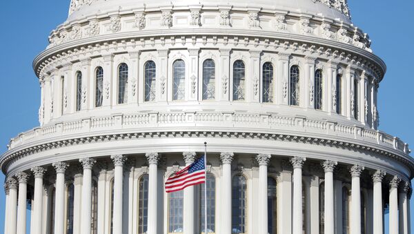 The American Flag flies at the U.S. Capitol Building, as Mayor Muriel Bowser declared a State of Emergency due to the coronavirus disease (COVID-19), on Capitol Hill in Washington, 18 March 2020. - Sputnik International