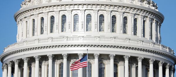 The American Flag flies at the U.S. Capitol Building, as Mayor Muriel Bowser declared a State of Emergency due to the coronavirus disease (COVID-19), on Capitol Hill in Washington, U.S., March 18, 2020. - Sputnik International