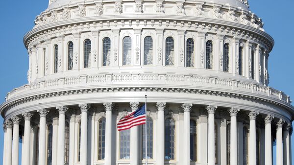 The American Flag flies at the U.S. Capitol Building, as Mayor Muriel Bowser declared a State of Emergency due to the coronavirus disease (COVID-19), on Capitol Hill in Washington, U.S., 18 March 2020. - Sputnik International