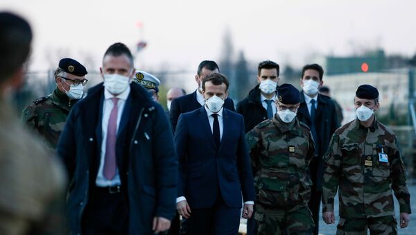 French President Emmanuel Macron wears a face mask during his visit to the military field hospital outside the Emile Muller Hospital in Mulhouse, eastern France March 25, 2020, during a strict lockdown in France to stop the spread of the coronavirus disease (COVID-19).   - Sputnik International