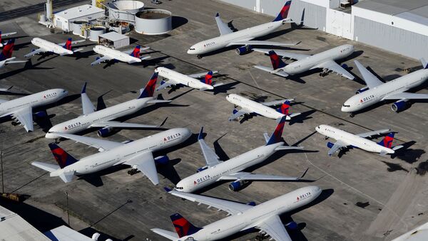 Delta Air Lines passenger planes are seen parked due to flight reductions made to slow the spread of coronavirus disease (COVID-19), at Birmingham-Shuttlesworth International Airport in Birmingham, Alabama, U.S. March 25, 2020. - Sputnik International