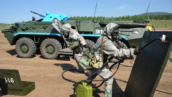 Members of a radiation, chemical and biological reconnaissance team use reagents to disinfect the surface of a dangerous area during the military-district stage of the Safe Environment 2016 army contest, involving radiation, chemical and biological reconnaissance teams in the Trans-Baikal Territory. - Sputnik International