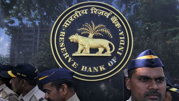 FILE PHOTO: Police stand guard as depositors (unseen) of the Punjab and Maharashtra Co-operative Bank (PMC) attend a protest over the Reserve Bank of India (RBI) curbs on the bank, outside a RBI office in Mumbai, India, October 1, 2019.  - Sputnik International