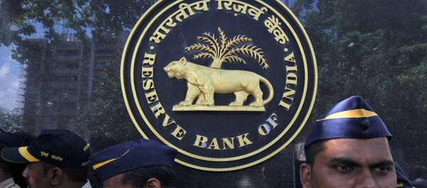 FILE PHOTO: Police stand guard as depositors (unseen) of the Punjab and Maharashtra Co-operative Bank (PMC) attend a protest over the Reserve Bank of India (RBI) curbs on the bank, outside a RBI office in Mumbai, India, October 1, 2019.  - Sputnik International