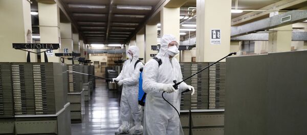 Cleaners sanitise documents inside the archives of Rome's Anagrafe, the city's Registration Office, as the coronavirus disease (COVID-19) spreads, in Rome, Italy, March 27, 2020. Cleaners sanitise documents inside the archives of Rome's Anagrafe, the city's Registration Office, as the coronavirus disease (COVID-19) spreads, in Rome, Italy, March 27, 2020. - Sputnik International