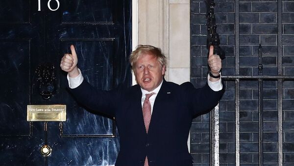 Britain's Prime Minister Boris Johnson gestures outside 10 Downing Street during the Clap for our carers campaign in support of the NHS, as the spread of the coronavirus disease (COVID-19) continues, London, Britain, March 26, 2020.  - Sputnik International