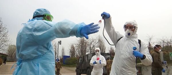 In this handout video grab released by the Russian Defence Ministry Russian military experts visit hospital facilities for elderly people to fight against the COVID-19 coronavirus infection, in Bergamo, Italy. In this handout video grab released by the Russian Defence Ministry Russian military experts visit hospital facilities for elderly people to fight against the COVID-19 coronavirus infection, in Bergamo, Italy. - Sputnik International