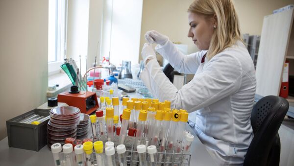 A laboratory worker is seen at Laboratory Diagnostic Department which performs diagnostic tests for coronavirus at Wielkopolska Center for Pulmonology and Thoracic Surgery in Poznan, Poland March 3, 2020. Picture taken March 3, 2020.  - Sputnik International
