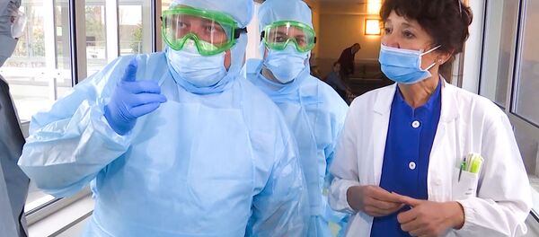 In this handout video grab released by the Russian Defence Ministry, Russian military experts visit hospital facilities for elderly people to fight against the COVID-19 coronavirus infection in Bergamo, Italy - Sputnik International