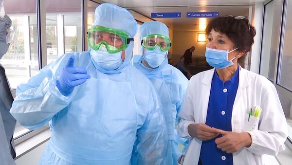 In this handout video grab released by the Russian Defence Ministry, Russian military experts visit hospital facilities for elderly people to fight against the COVID-19 coronavirus infection in Bergamo, Italy - Sputnik International