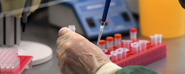 Scientist in Laboratory Conducts COVID-19 Test Scientist in Laboratory Conducts COVID-19 Test - Sputnik International