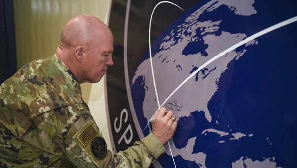 General John Raymond, U.S. Space Force chief of space operations, signs the United States Space Command sign inside of the Perimeter Acquisition Radar building Jan. 10, 2020, on Cavalier Air Force Station, North Dakota.  - Sputnik International