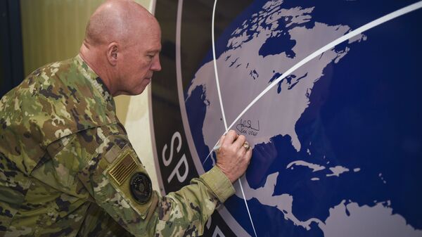 General John Raymond, U.S. Space Force chief of space operations, signs the United States Space Command sign inside of the Perimeter Acquisition Radar building Jan. 10, 2020, on Cavalier Air Force Station, North Dakota.  - Sputnik International
