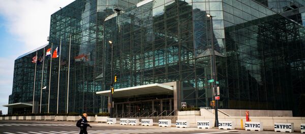 A woman walks by the Javits Convention Center as the coronavirus disease (COVID-19) outbreak continues in New York, U.S., March 22, 2020 A woman walks by the Javits Convention Center as the coronavirus disease (COVID-19) outbreak continues in New York, U.S., March 22, 2020 - Sputnik International