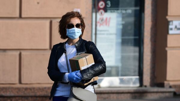 Girl in medical mask and gloves on Moscow Street - Sputnik International