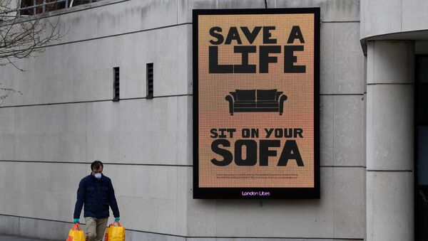 A man walks past a Public Health advertisment in London - Sputnik International