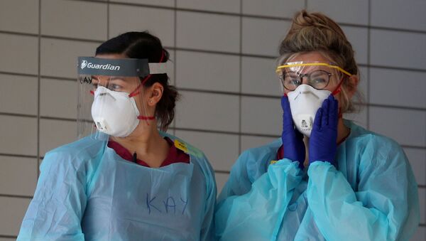 Medical staff wearing protective clothing at St Thomas' hospital as the spread of the coronavirus disease (COVID-19) continues, London, Britain, 31 March 2020. - Sputnik International