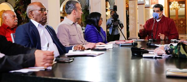 Venezuela's President Nicolas Maduro wears a protective face mask as he speaks during a meeting at Miraflores Palace in Caracas, Venezuela March 13, 2020.  - Sputnik International