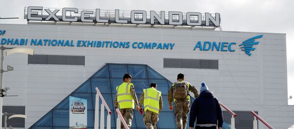 Members of Britain's armed forces arrive at the ExCeL London exhibition centre in London on March 31, 2020, where the NHS Nightingale field hospital has been created to help with the novel coronavirus COVID-19 pandemic. - Sputnik International
