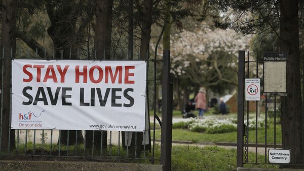 A large sign at the entrance to a park asking people top stay at home to help stop the spread of the coronavirus in London, Wednesday, April 1, 2020. The new coronavirus causes mild or moderate symptoms for most people, but for some, especially older adults and people with existing health problems, it can cause more severe illness or death. - Sputnik International
