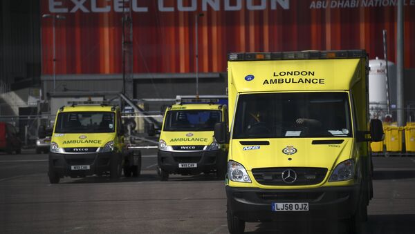 Ambulances at the ExCel Center in London, Thursday, April 2, 2020, that is being turned into a 4000 bed temporary hospital know as NHS Nightingale to help deal with some of the coronavirus outbreak victims in London. The new coronavirus causes mild or moderate symptoms for most people, but for some, especially older adults and people with existing health problems, it can cause more severe illness or death. - Sputnik International