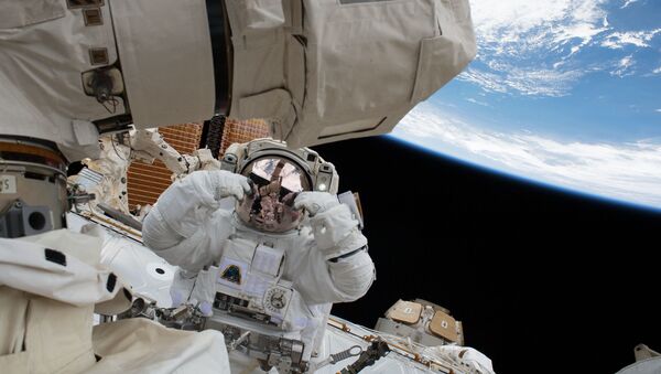 NASA astronaut Scott Tingle is pictured during a spacewalk to swap out a degraded robotic hand, or Latching End Effector, on the Canadarm2. NASA astronaut Mark Vande Hei also participated in the robotics maintenance spacewalk. - Sputnik International