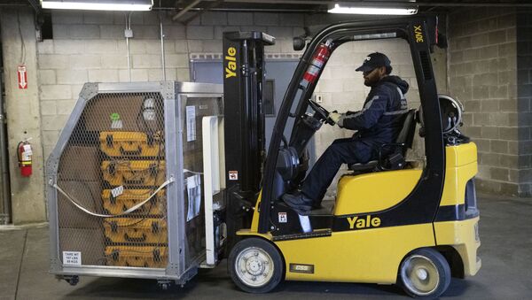 A cage of ventilators is moved by forklift, Tuesday, March 24, 2020 at the New York City Emergency Management Warehouse, where 400 ventilators have arrived and will be distributed. - Sputnik International