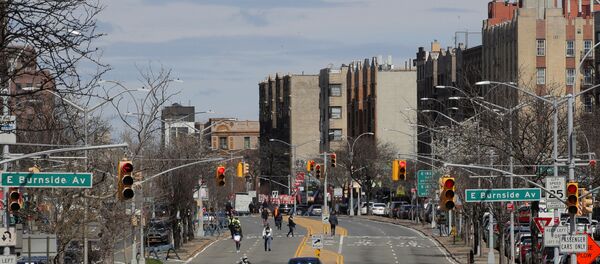 People walk on a temporarily closed section of the Grand Concourse during the outbreak of the coronavirus disease (COVID-19) in the Bronx borough of New York City, New York, U.S., April 2, 2020 People walk on a temporarily closed section of the Grand Concourse during the outbreak of the coronavirus disease (COVID-19) in the Bronx borough of New York City, New York, U.S., April 2, 2020 - Sputnik International