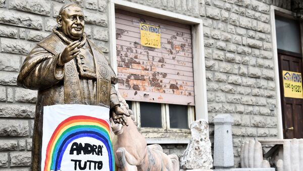A sign reading Everything will be fine hangs on a statue of Pope John XXIII in Zogno near Bergamo, one of Italy's cities worst-hit by coronavirus disease (COVID-19), Italy March 22, 2020 - Sputnik International