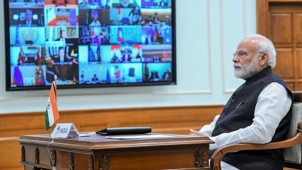 In this handout photo taken and released by Indian Press Information Bureau (PIB) on March 26, 2020, India's Prime Minister Narendra Modi attends a videoconference with G20 leaders to discuss the COVID-19 coronavirus, in New Delhi - Sputnik International