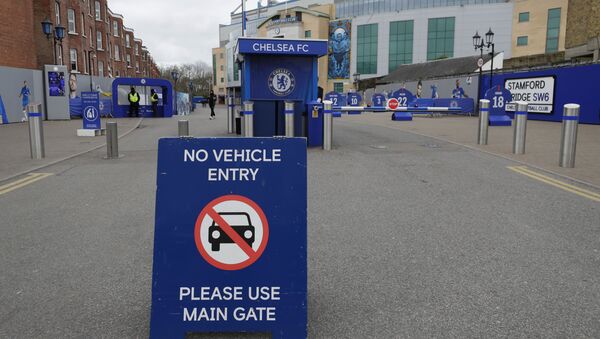 A sign at Chelsea's Stamford Bridge stadium, as the English Premier League is suspended until April 3, in London, Friday, March 13, 2020.  - Sputnik International