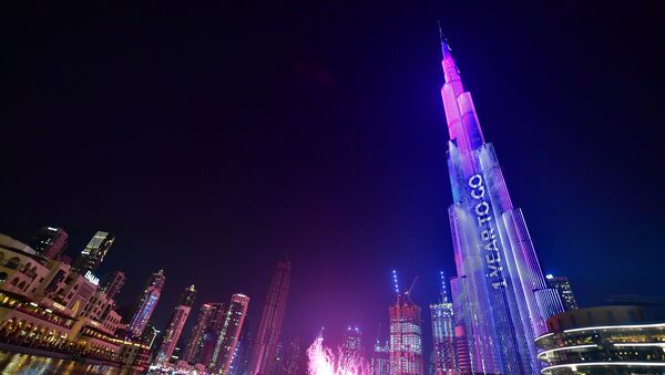 Dubai's Burj Khalifa, the world’s tallest building is illuminated during festivities marking the one-year countdown to Expo 2020 - Sputnik International